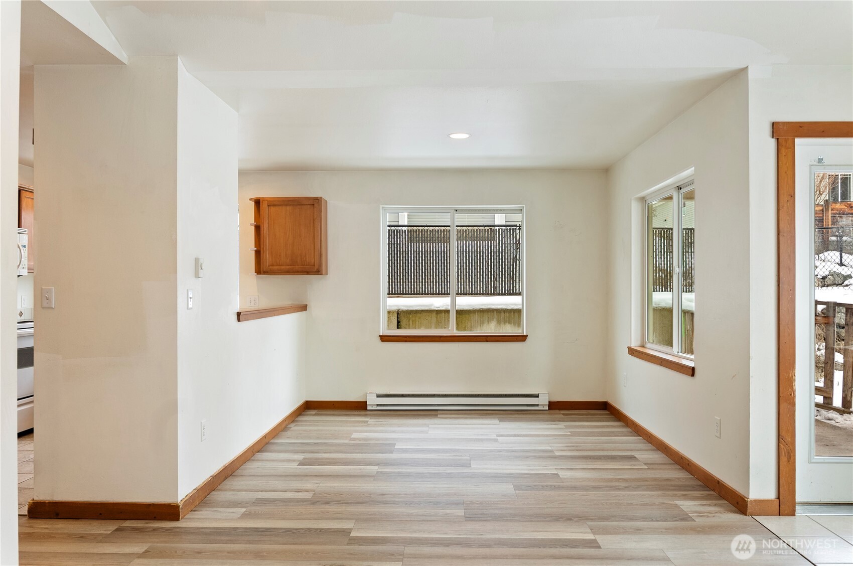 203 Washington Street Winthrop, WA 98862 - Photo 8 of 39 a view of empty room with wooden floor and fan