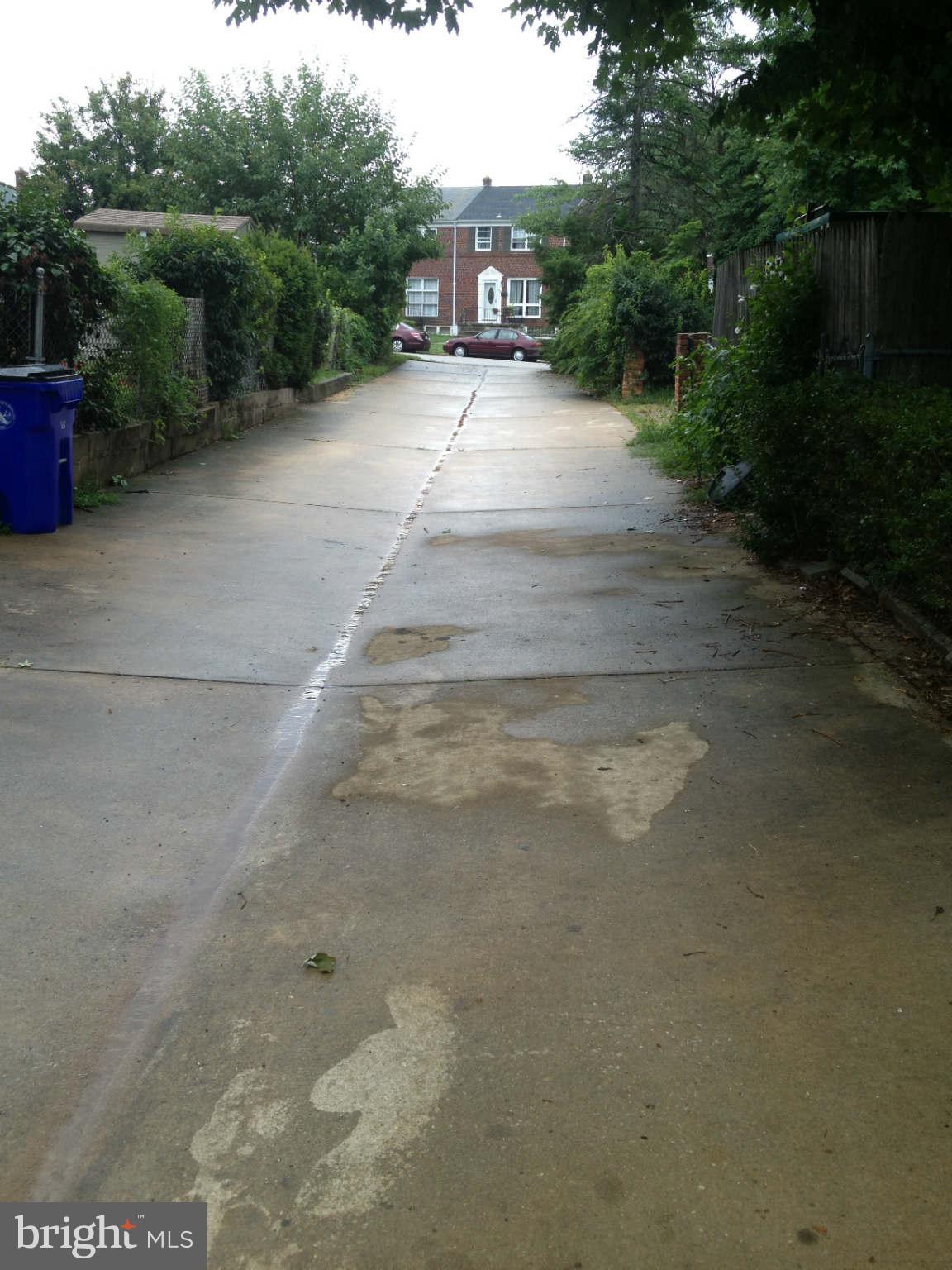 907 Masefield Road Baltimore, MD 21207 - Photo 22 of 23 a view of city street with a small yard