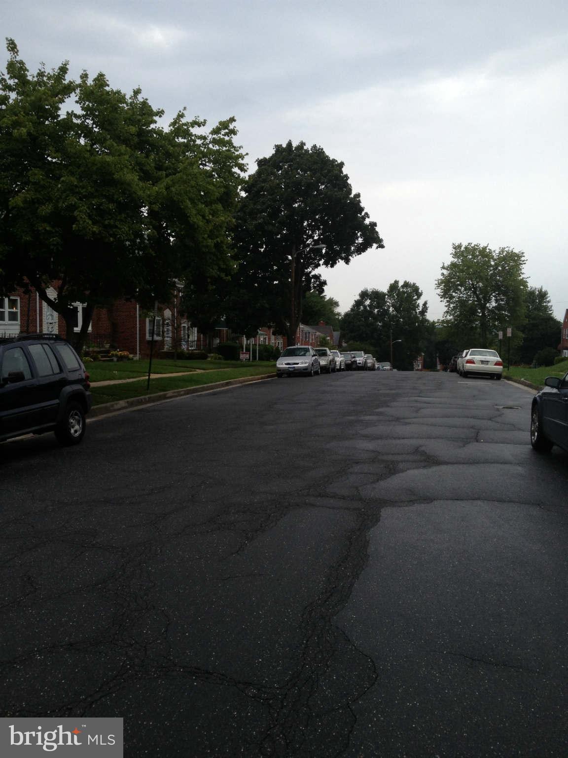907 Masefield Road Baltimore, MD 21207 - Photo 23 of 23 a view of street with parked cars