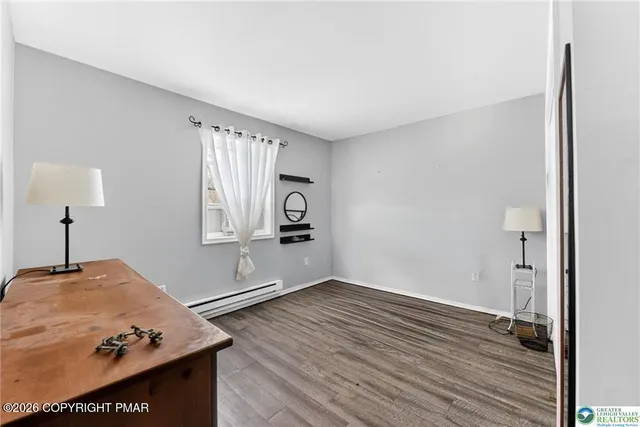a view of workspace with wooden floor