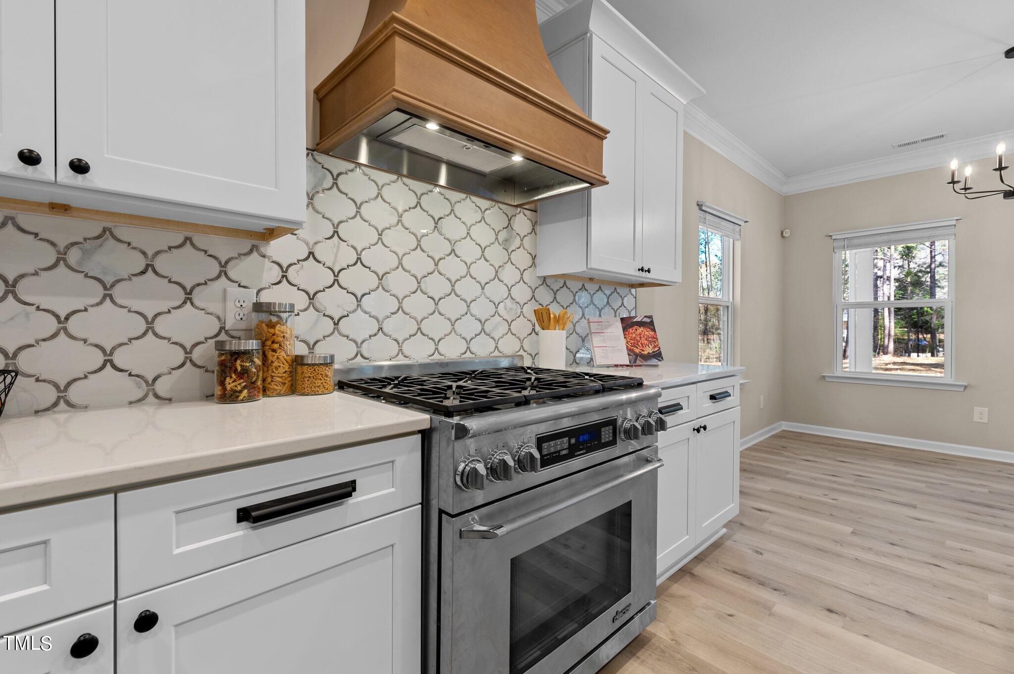 2009 Delphi Way Wake Forest, NC 27587 - Photo 11 of 40 a stove top oven sitting inside of a kitchen