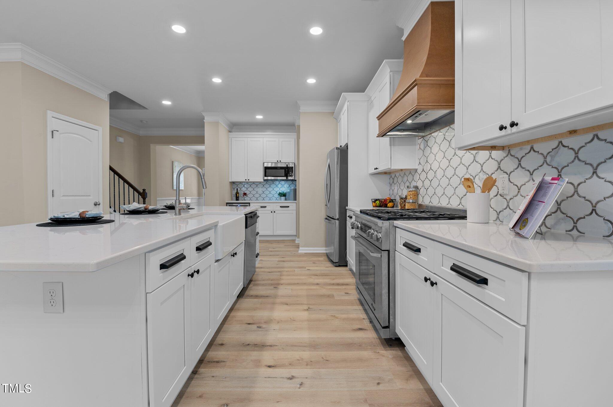 2009 Delphi Way Wake Forest, NC 27587 - Photo 12 of 40 a kitchen with granite countertop a sink and cabinets