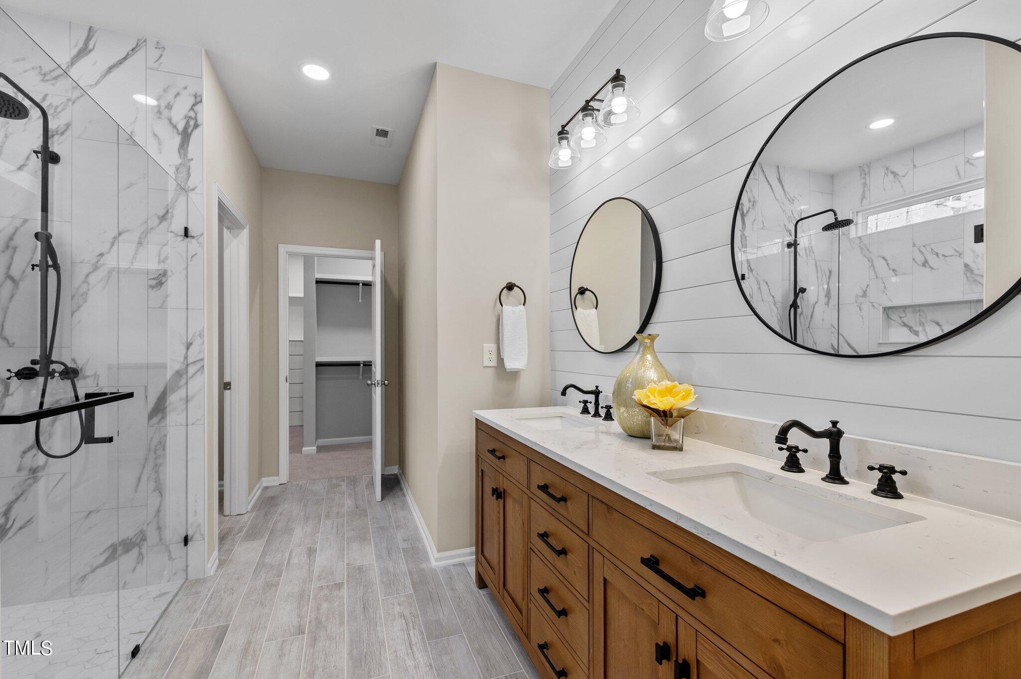 2009 Delphi Way Wake Forest, NC 27587 - Photo 23 of 40 a bathroom with a double vanity sink double vanity and a mirror