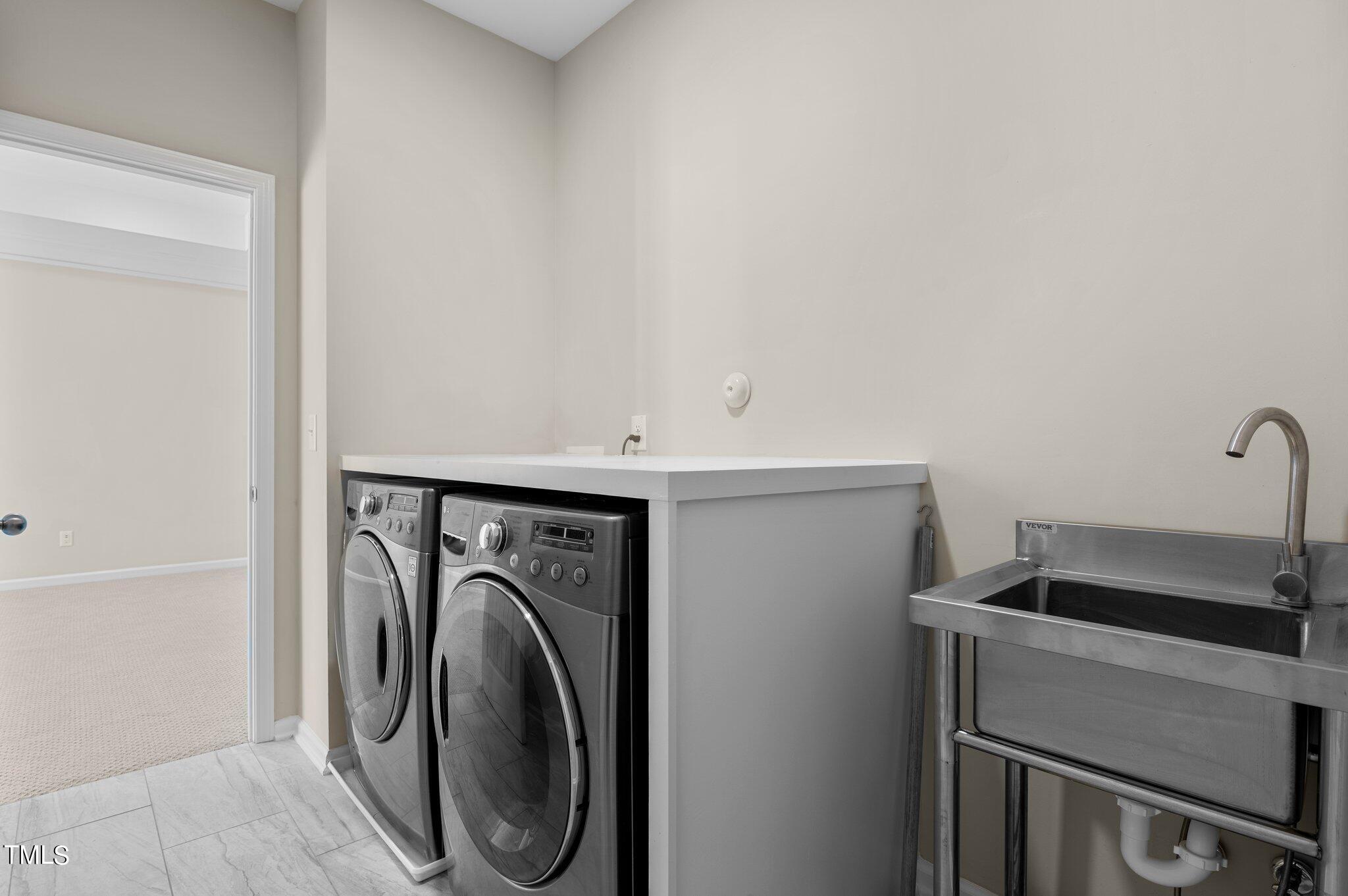 2009 Delphi Way Wake Forest, NC 27587 - Photo 28 of 40 a utility room with dryer and washer