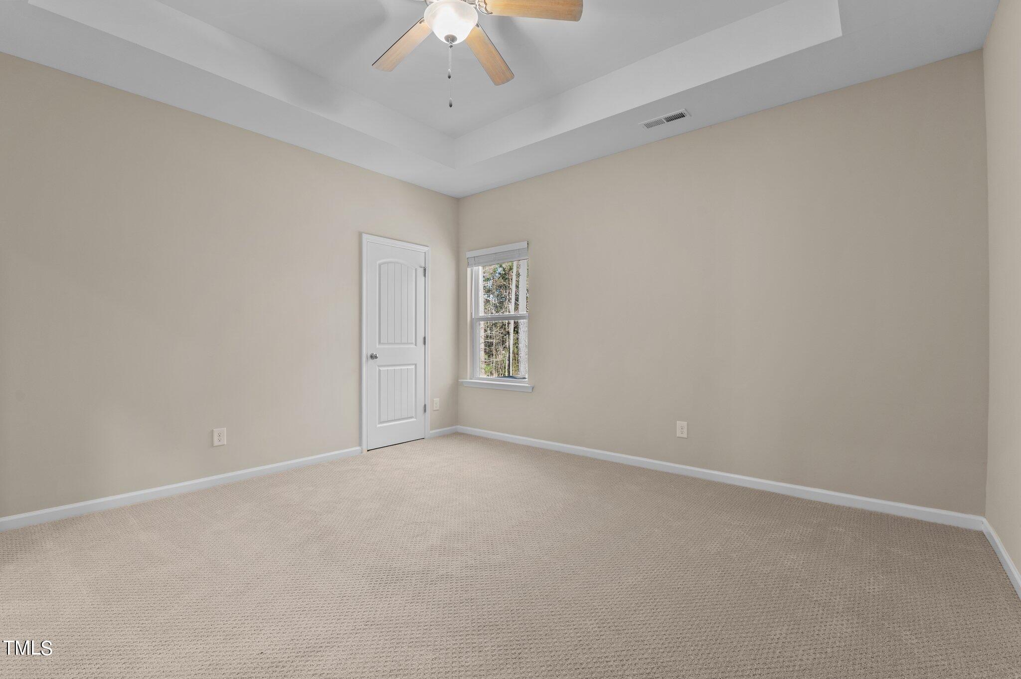 2009 Delphi Way Wake Forest, NC 27587 - Photo 29 of 40 a view of an empty room with a chandelier fan