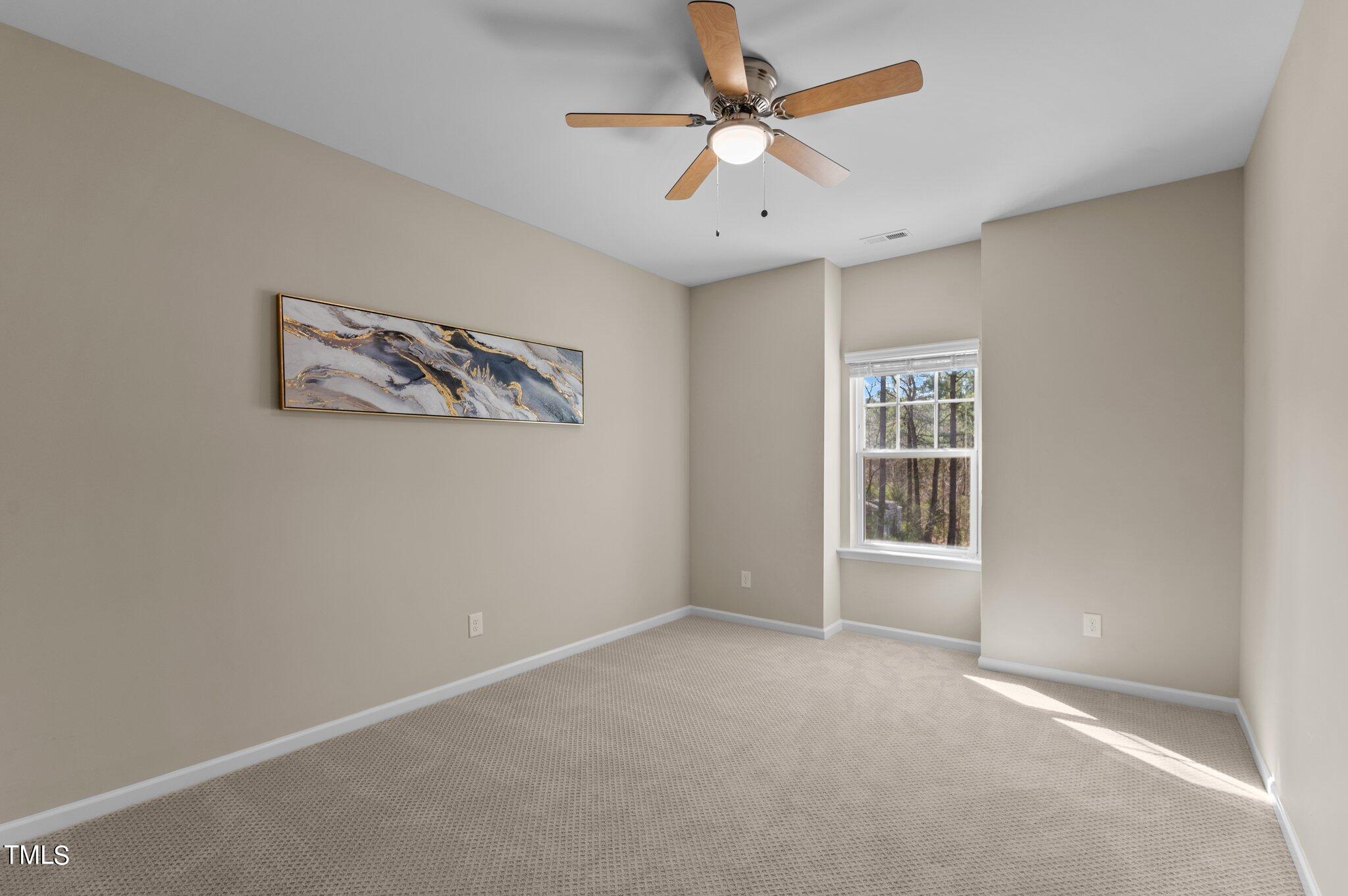 2009 Delphi Way Wake Forest, NC 27587 - Photo 32 of 40 an empty room with windows and fan