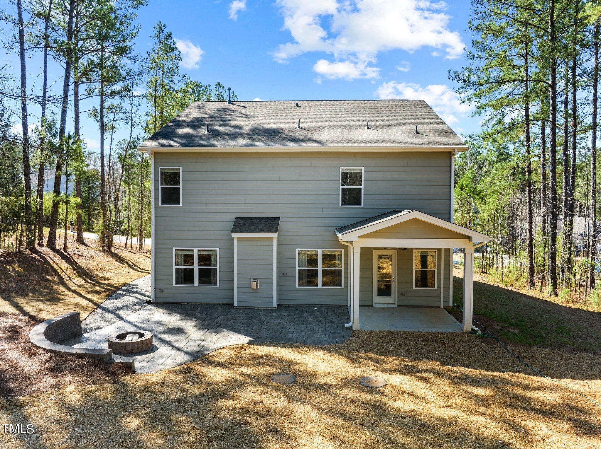 2009 Delphi Way Wake Forest, NC 27587 - Photo 34 of 40 a view of a house with a yard and sitting area