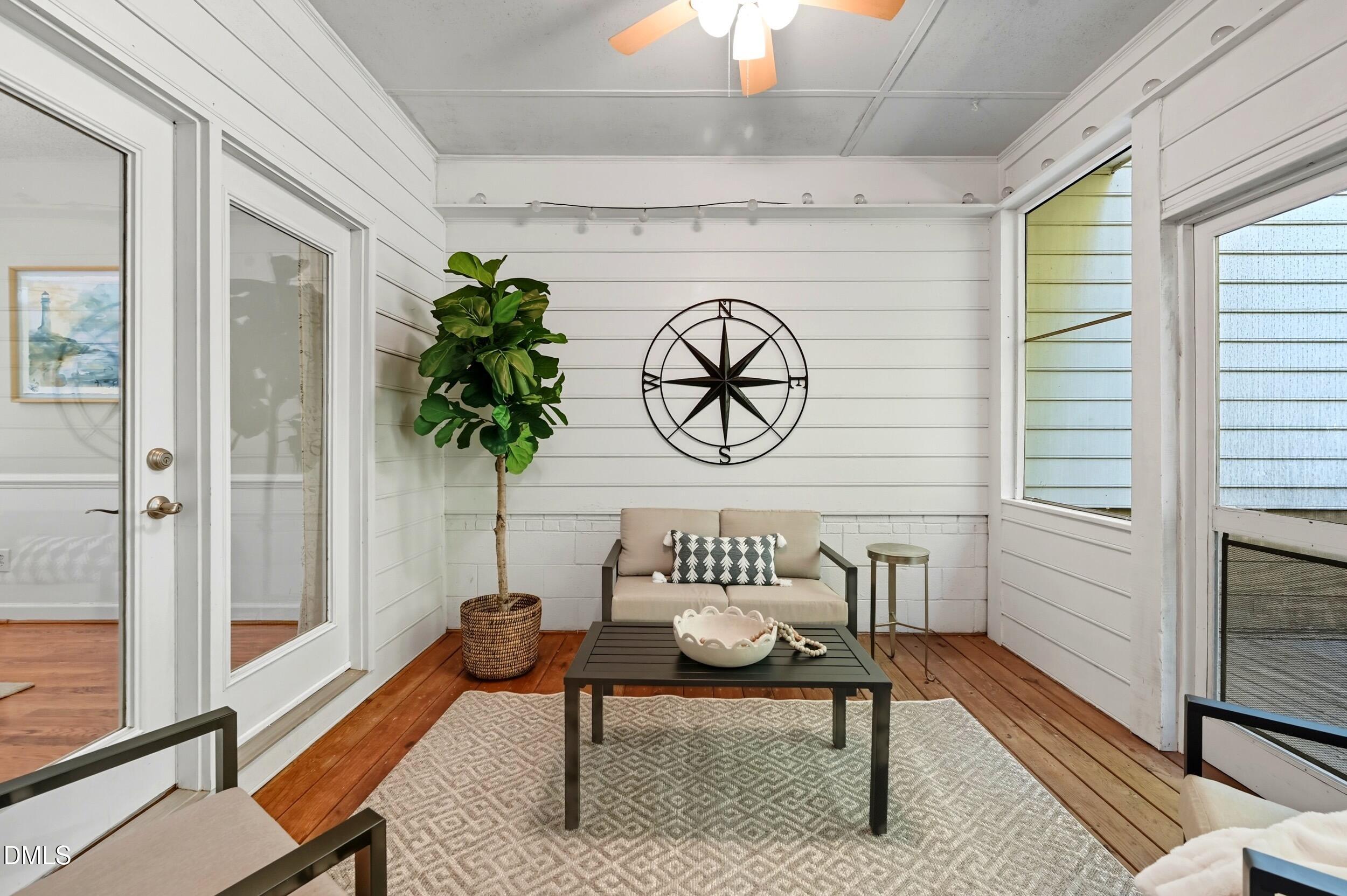 4111 Settlement Drive Durham, NC 27713 - Photo 13 of 25 a view of a hallway with wooden floor and a potted plant