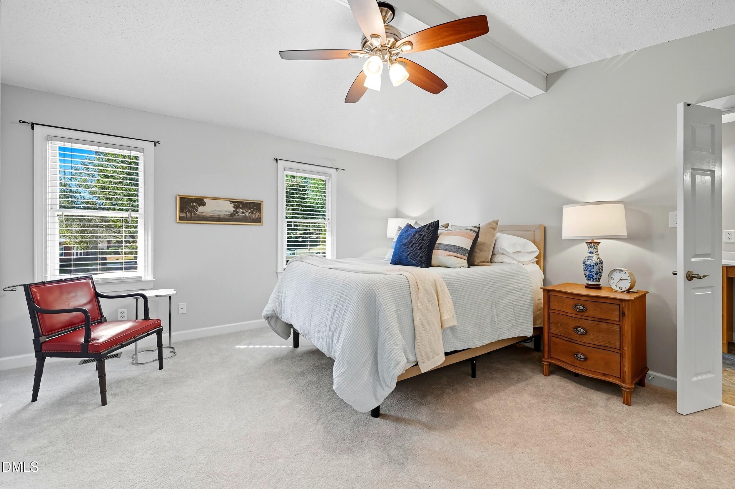4111 Settlement Drive Durham, NC 27713 - Photo 14 of 25 a bedroom with a bed and a chandelier