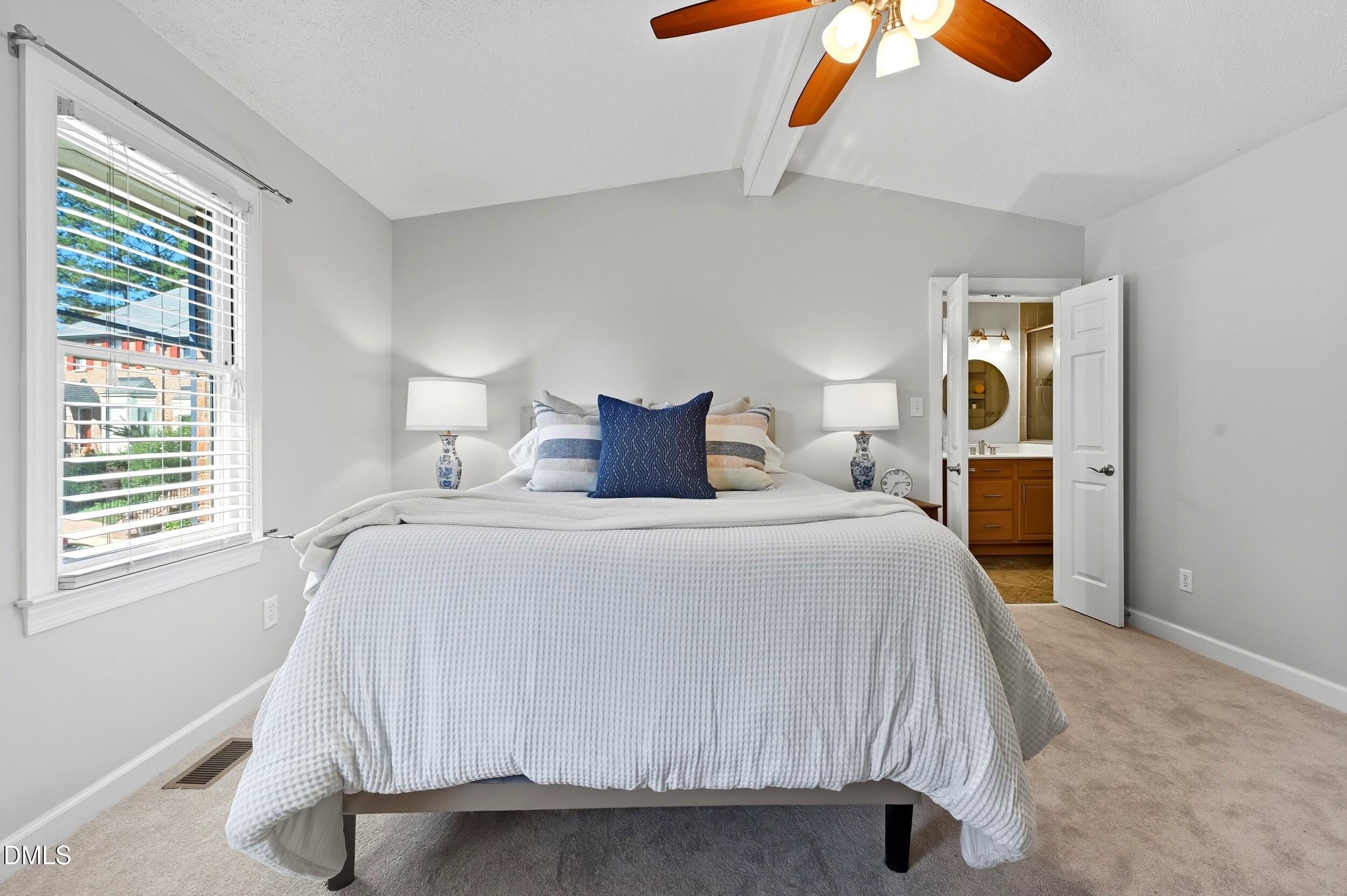 4111 Settlement Drive Durham, NC 27713 - Photo 15 of 25 a bedroom with a bed and window