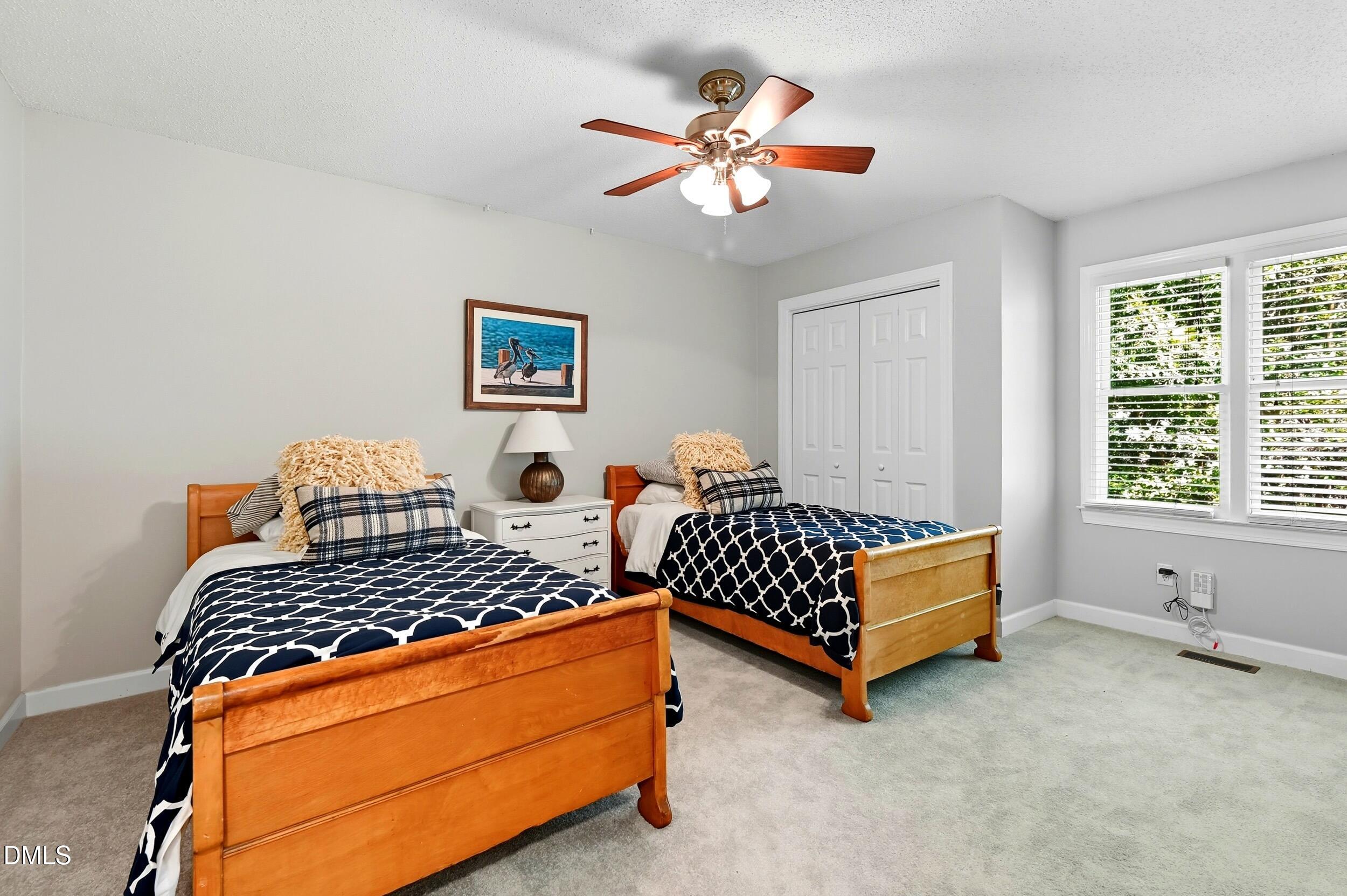4111 Settlement Drive Durham, NC 27713 - Photo 18 of 25 a bedroom with bed and window