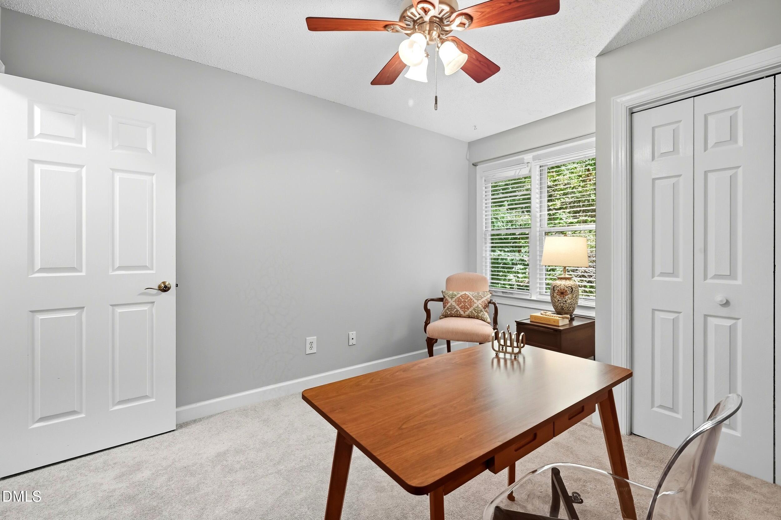 4111 Settlement Drive Durham, NC 27713 - Photo 21 of 25 a view of a dining room with furniture window and wooden floor
