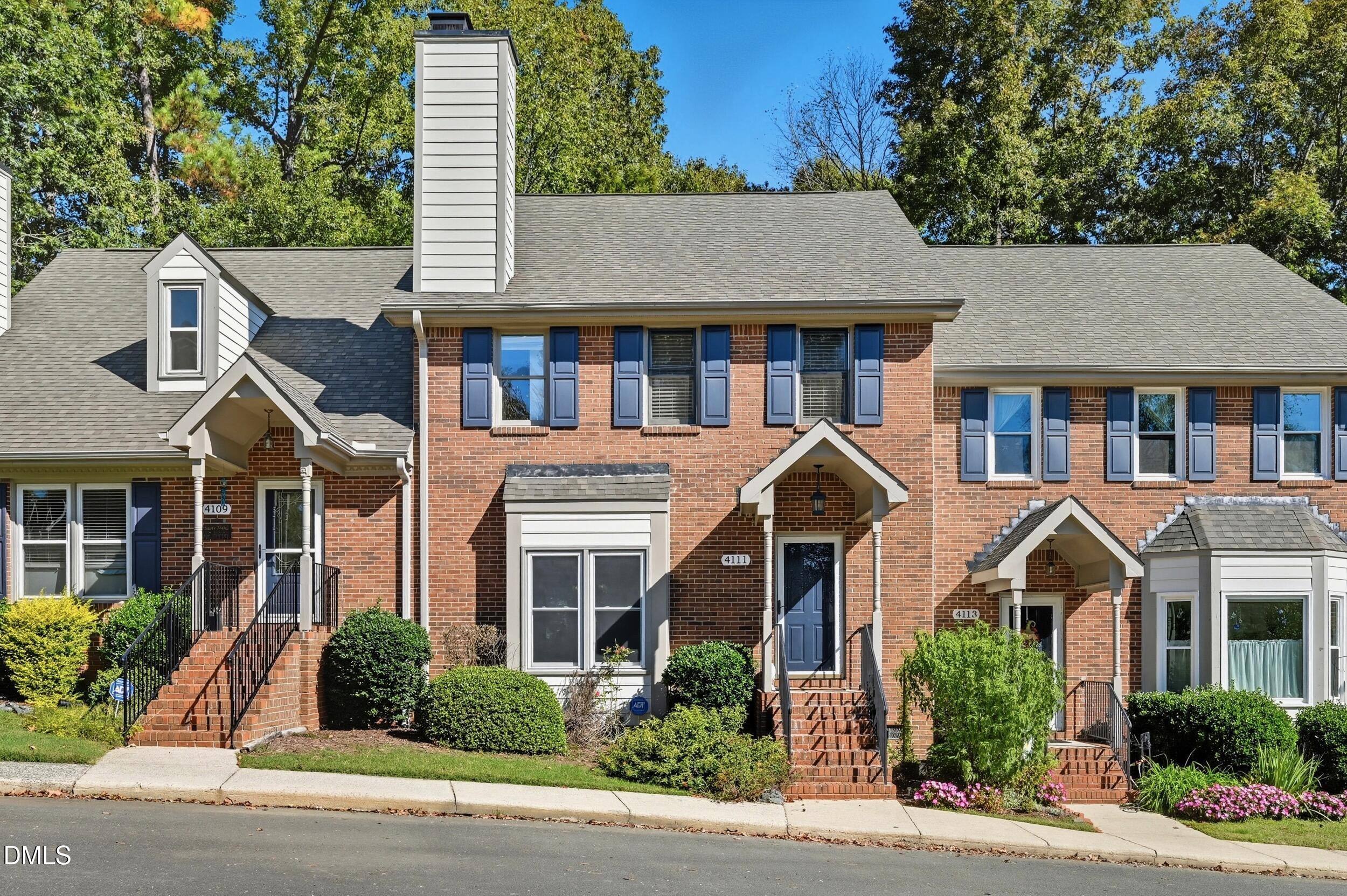 4111 Settlement Drive Durham, NC 27713 - Photo 2 of 25 a aerial view of a brick house next to a yard