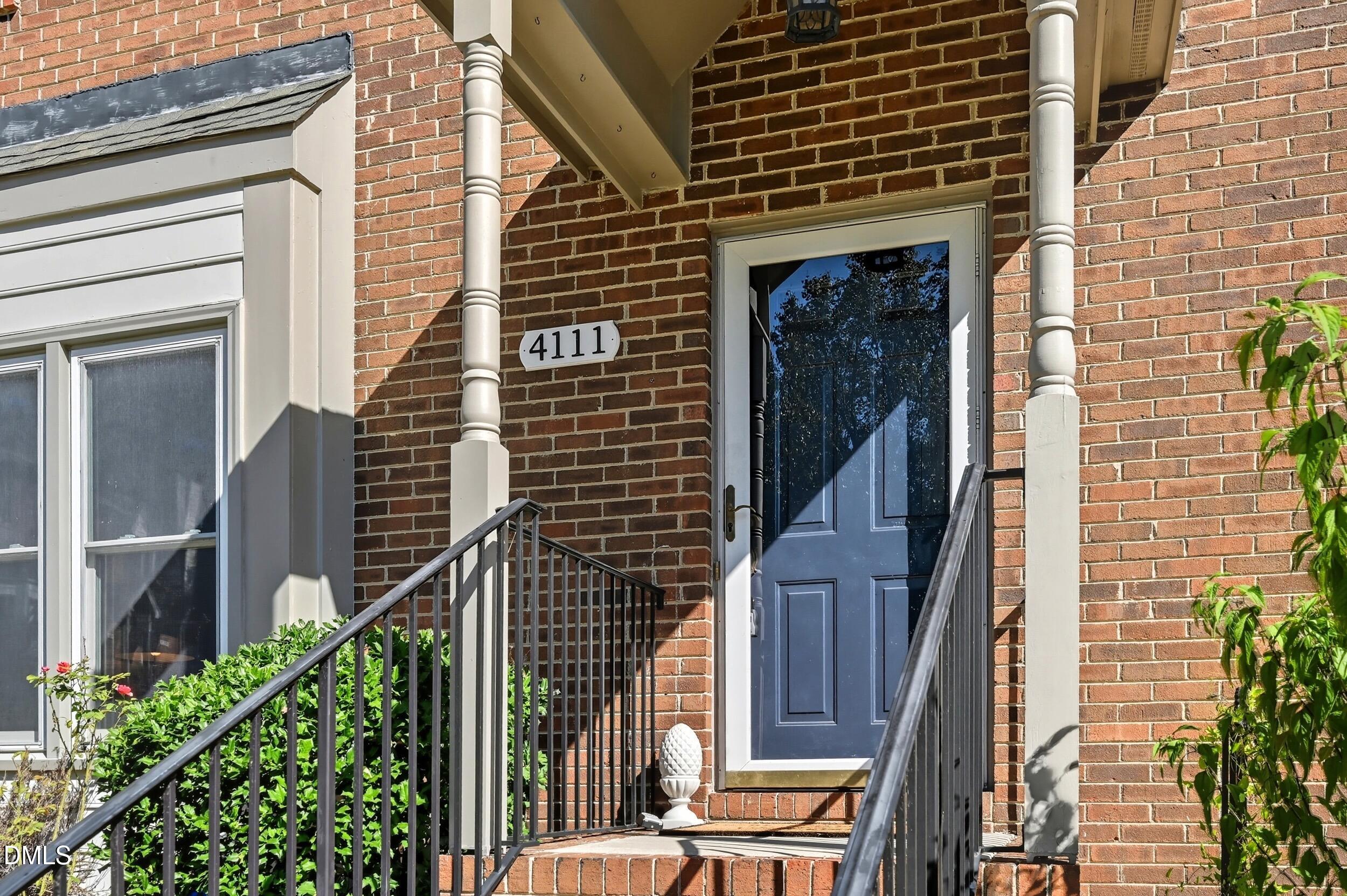 4111 Settlement Drive Durham, NC 27713 - Photo 3 of 25 a front view of a house with a tree