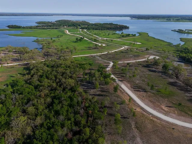 a view of a field with an ocean