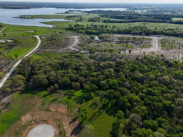 an aerial view of a houses with a outdoor space