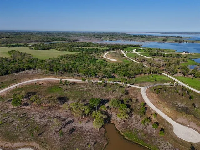 a view of a yard with a wooden deck and a yard
