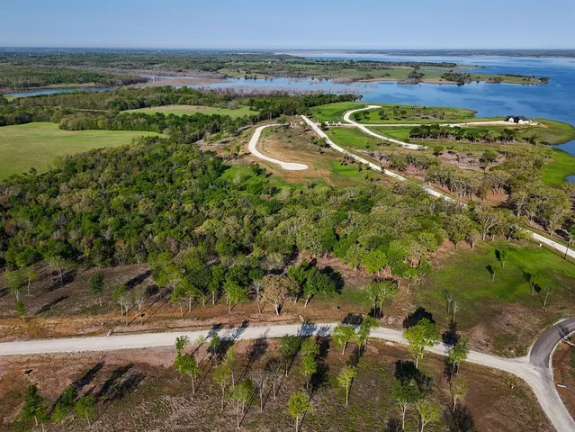 a view of a water with a field