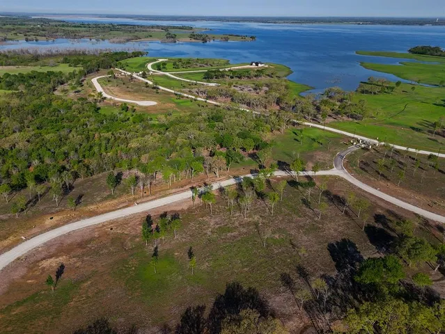 a view of a swimming pool with a yard