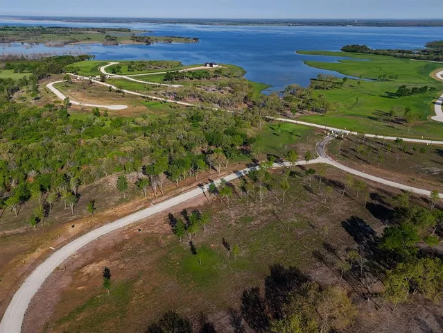 a view of a swimming pool and a yard