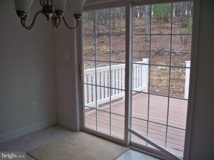 2 McCoy Road Berkeley Springs, WV 25411 - Photo 17 of 24 From dinning area out to back deck and yard.
