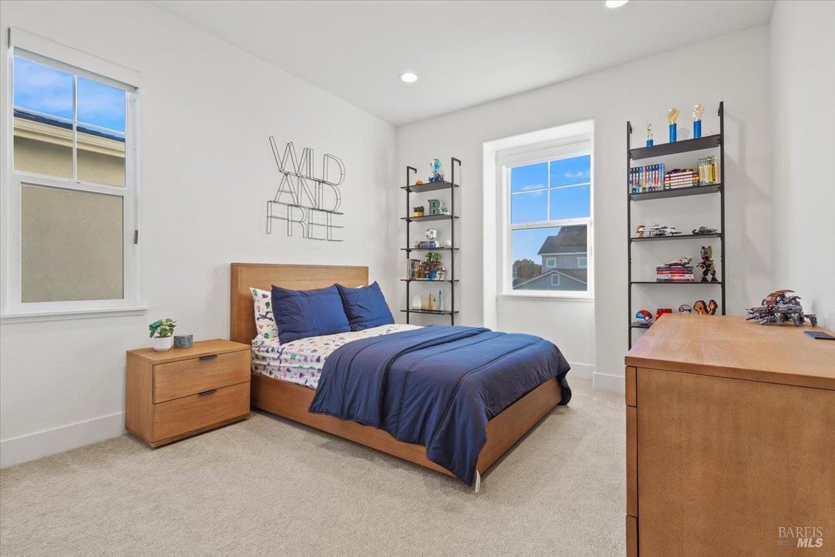 1469 Oak Circle Rohnert Park, CA 94928 - Photo 29 of 42 Bright, Spacious & Private Located within the home's private upstairs retreat wing, this generously sized bedroom offers abundant natural light, a large closet, and easy access to the nearby bathroom and retreat area.