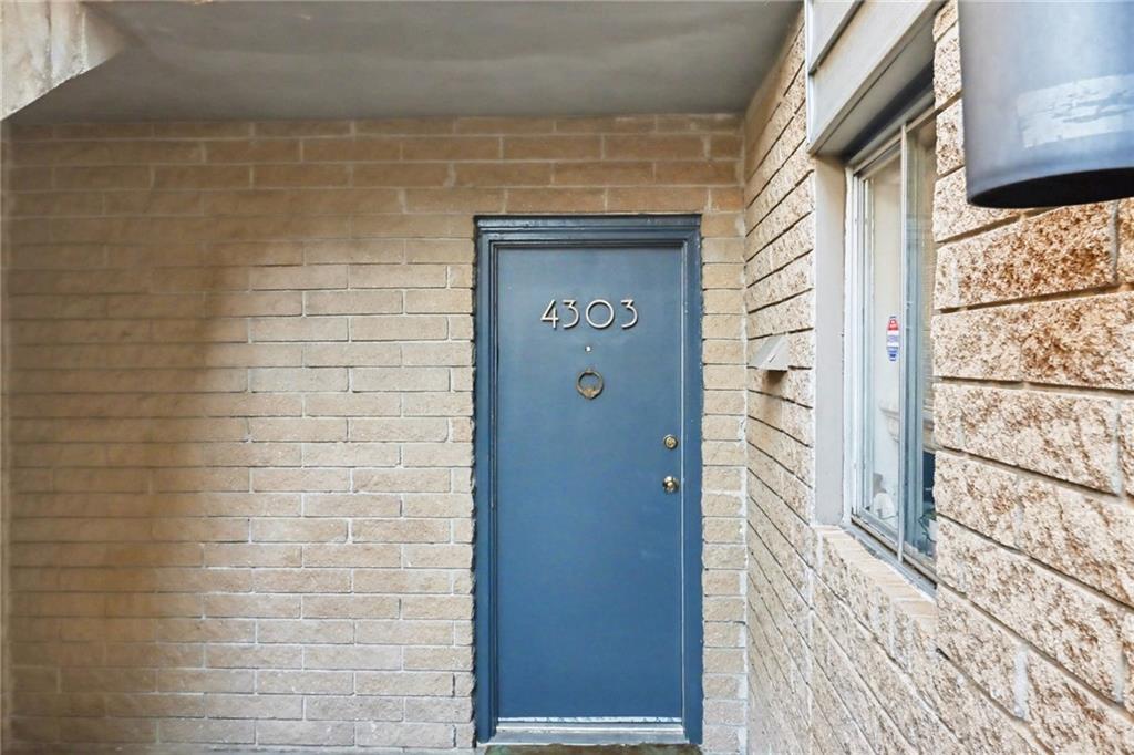 4300 Roswell Road Northeast, Unit 4303 Atlanta, GA 30342 - Photo 6 of 39 a view of a door and wooden floor