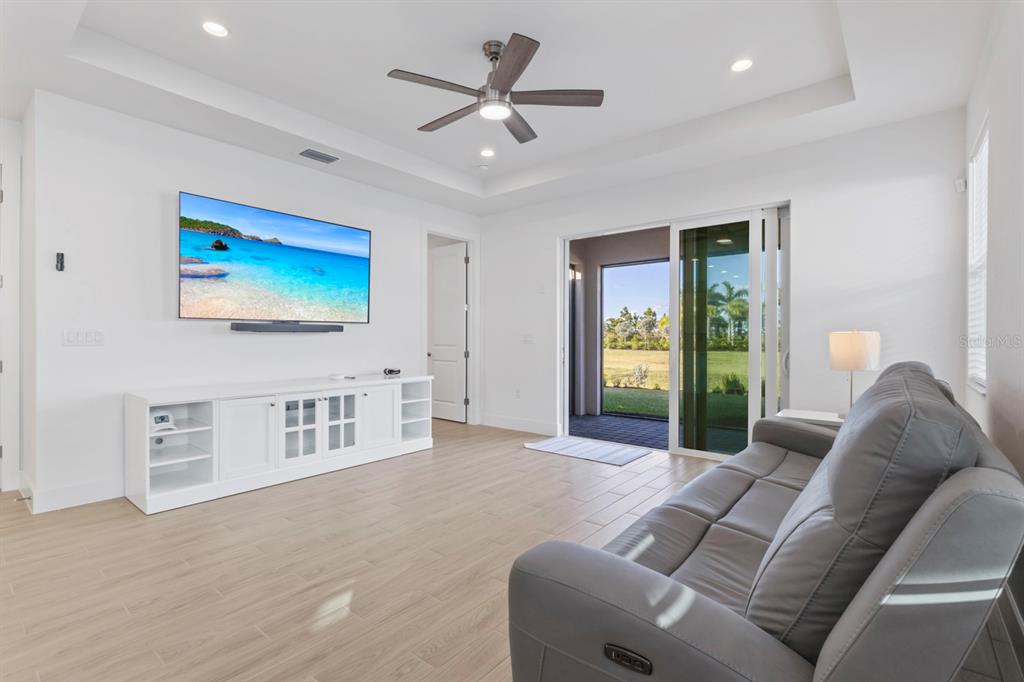 44319 Panther Drive Punta Gorda, FL 33982 - Photo 15 of 49 a living room with furniture a ceiling fan and a rug