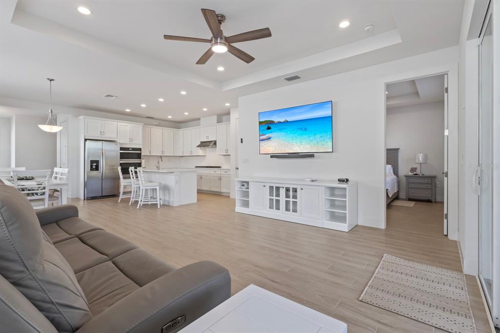 44319 Panther Drive Punta Gorda, FL 33982 - Photo 16 of 49 a living room with furniture kitchen view and a chandelier