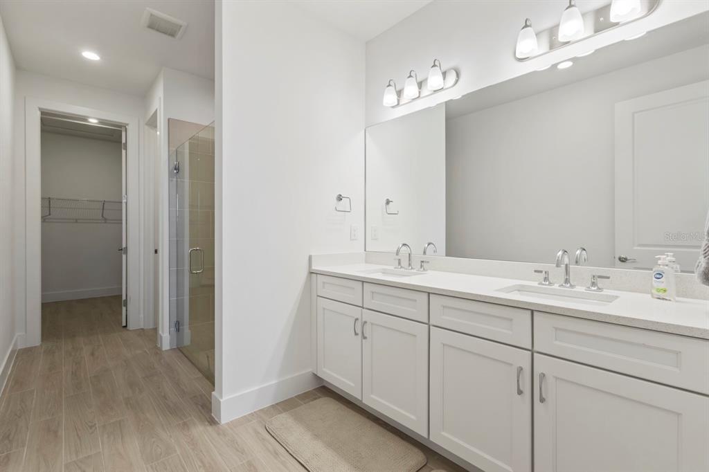 44319 Panther Drive Punta Gorda, FL 33982 - Photo 17 of 49 a bathroom with double vanity sinks and a mirror