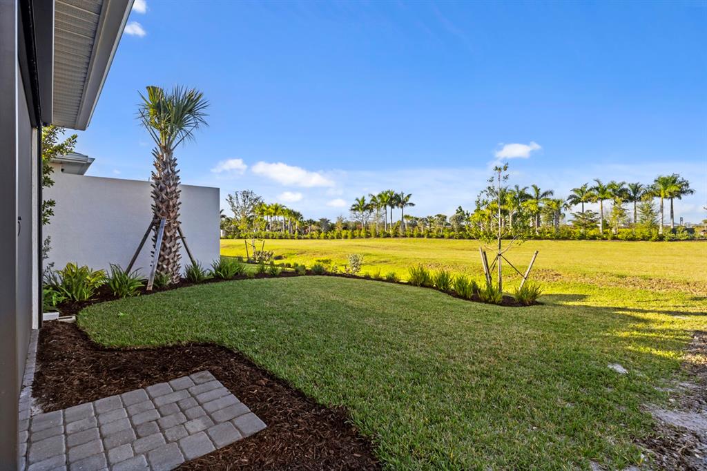 44319 Panther Drive Punta Gorda, FL 33982 - Photo 30 of 49 a view of a garden with a building in the background
