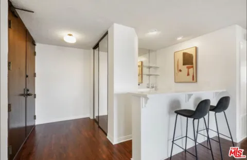 a view of kitchen with furniture and wooden floor