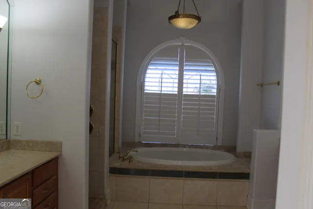 a white toilet sitting next to a small sink