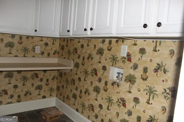 a bathroom with a shower curtain and a sink