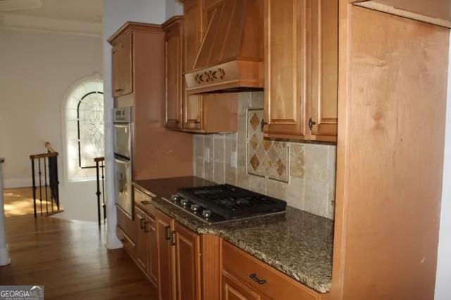 a bathroom with a shower curtain and a sink