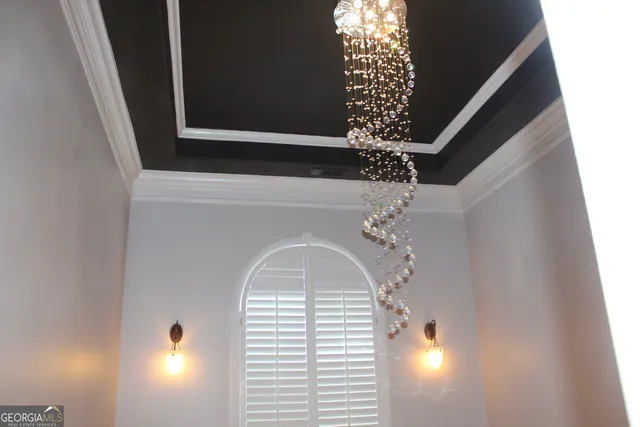 a kitchen with stainless steel appliances granite countertop a refrigerator a stove and a wooden floors