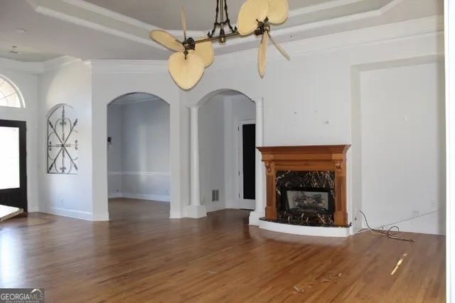 a living room with a fireplace and a window
