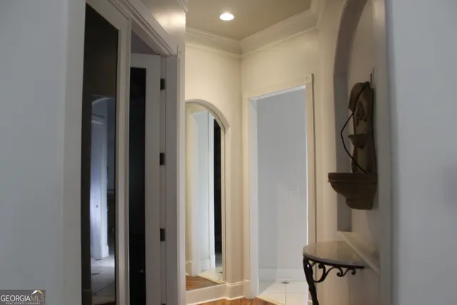 a bathroom with a sink a light fixture and a mirror