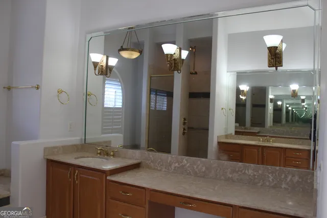 a bathroom with a glass door shower