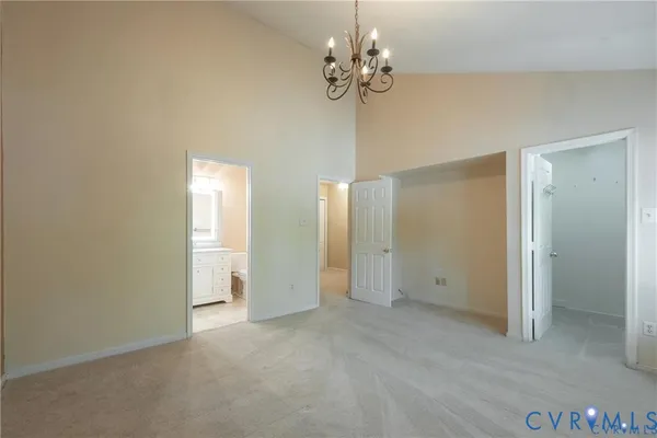 a kitchen with a refrigerator sink and cabinets