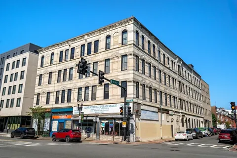 a front view of a building with street view