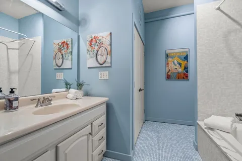 a bathroom with a sink a vanity and a mirror