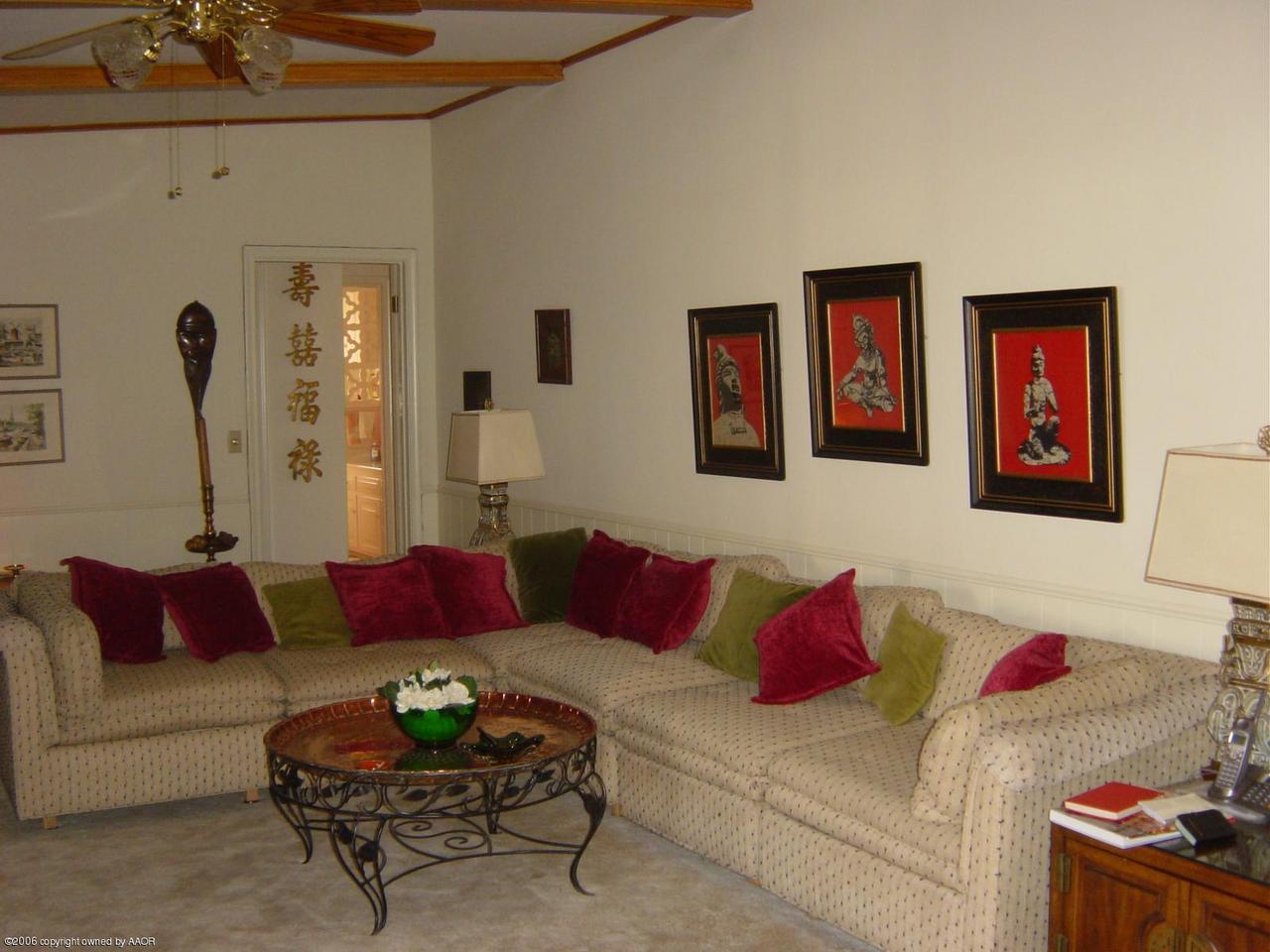 6312 Jameson Road Amarillo, TX 79106 - Photo 8 of 15 a living room with furniture and a couch