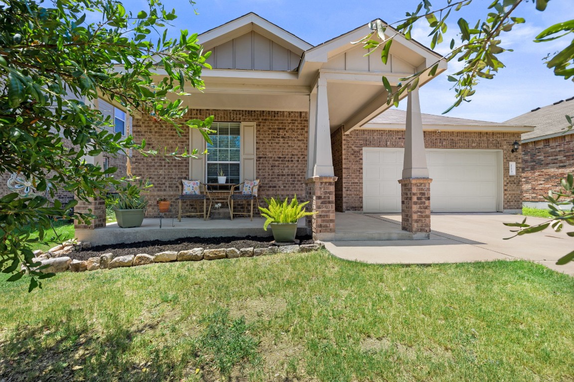 113 Thrasher Cove Leander, TX 78641 - Photo 1 of 1 a front view of a house with swimming pool and porch with furniture