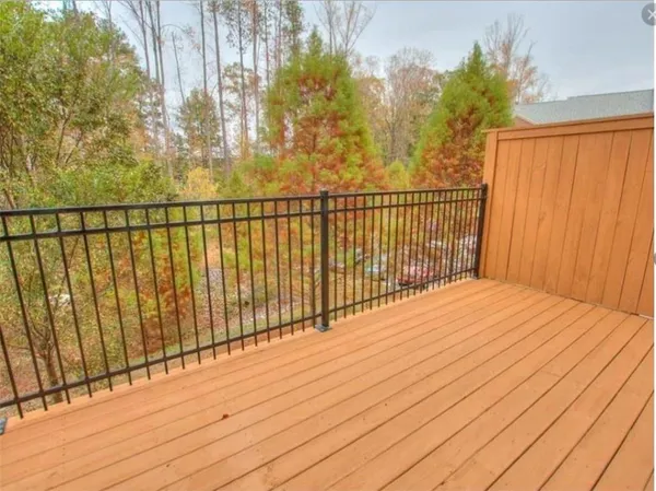 a view of balcony with wooden floor