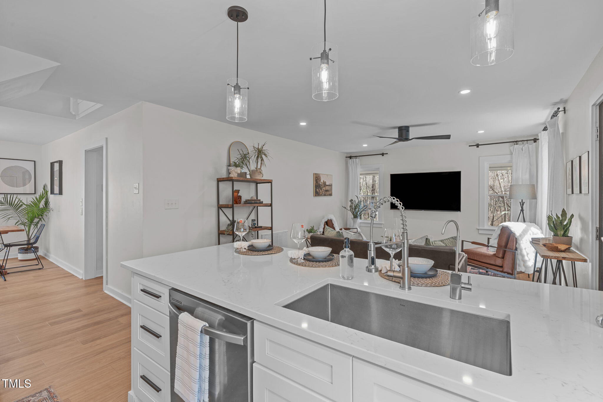211 Fleming Drive Durham, NC 27712 - Photo 11 of 34 a kitchen with center island and living room