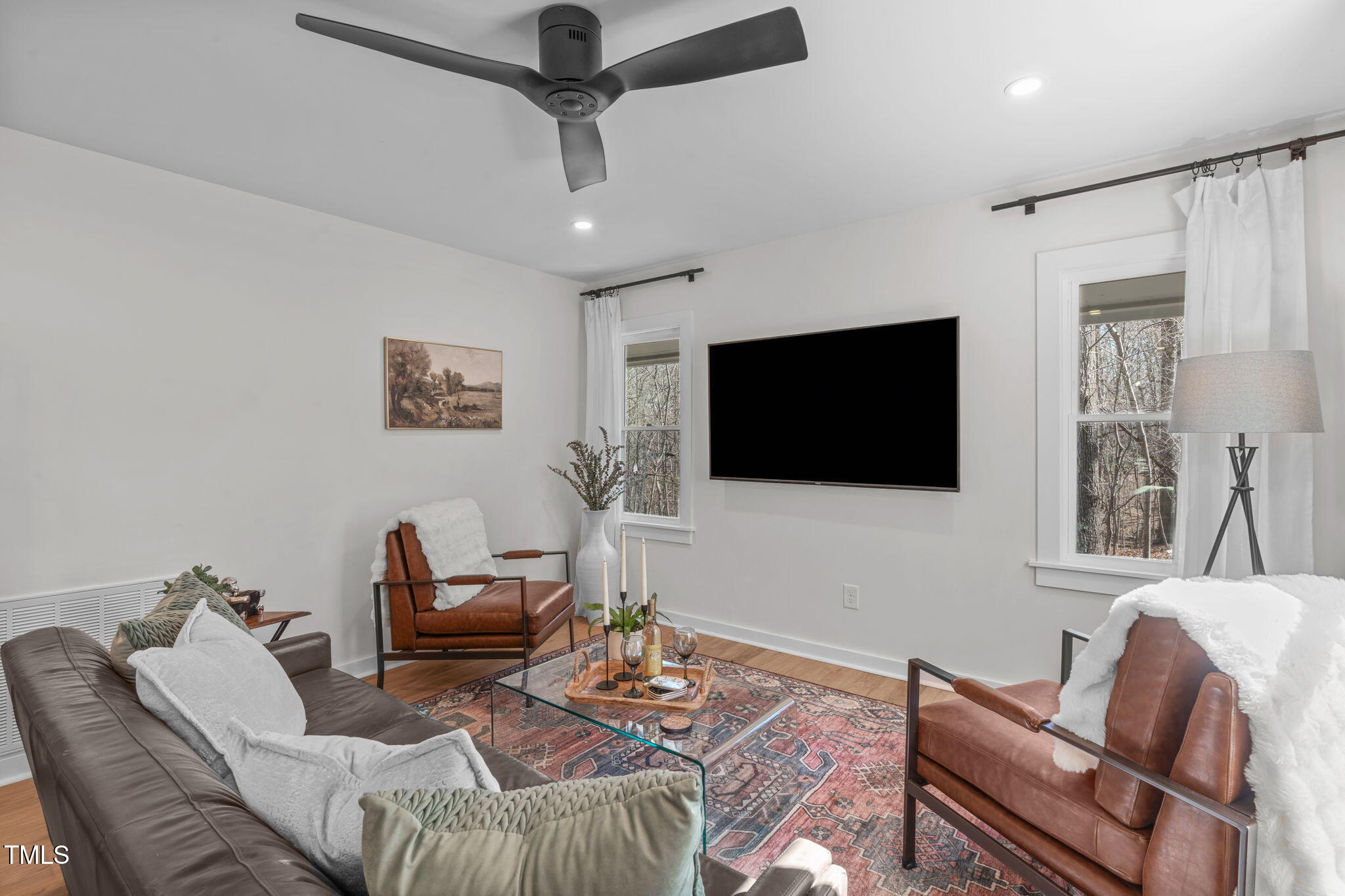211 Fleming Drive Durham, NC 27712 - Photo 13 of 34 a living room with furniture and a flat screen tv
