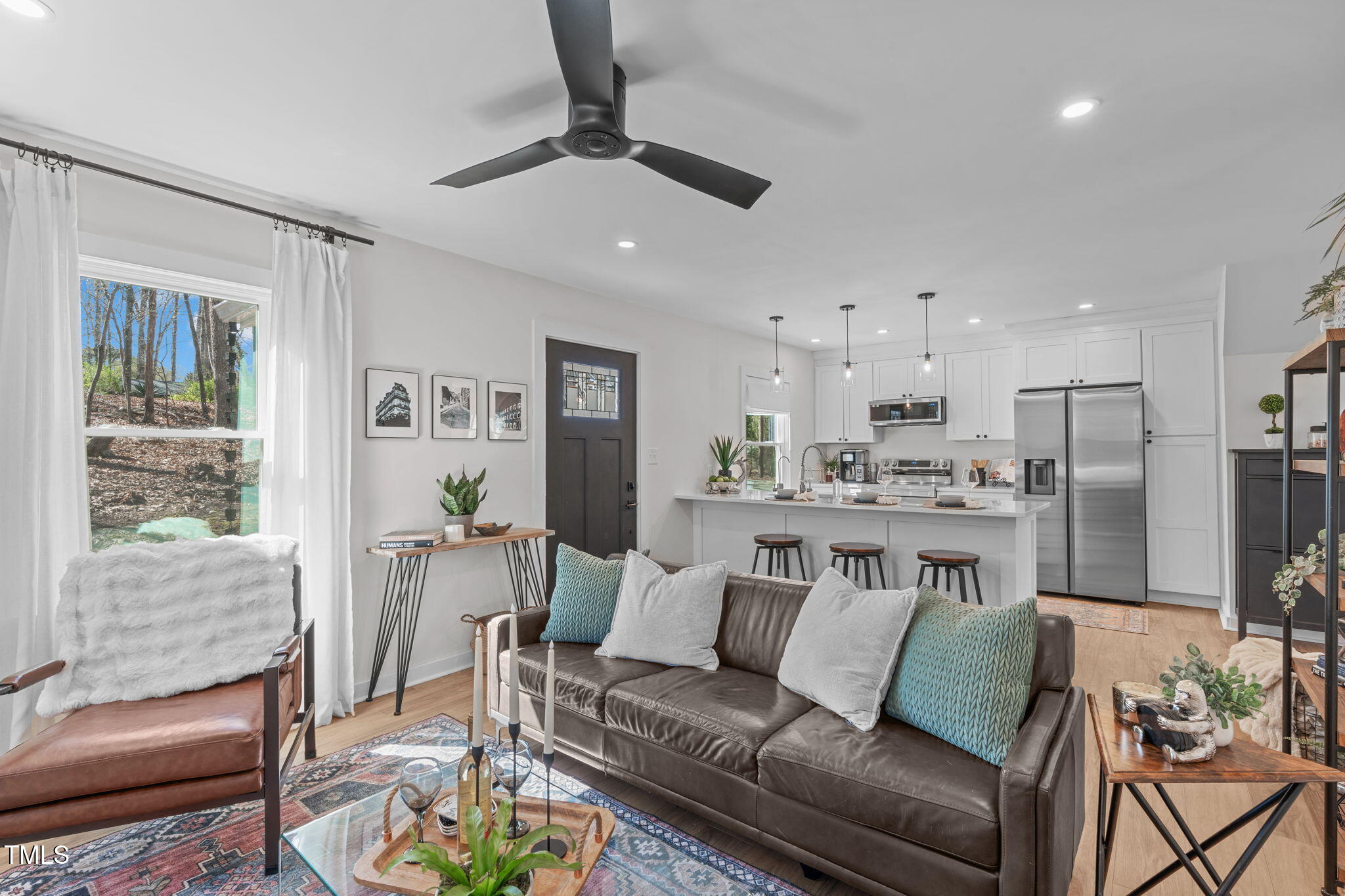 211 Fleming Drive Durham, NC 27712 - Photo 15 of 34 a living room with furniture kitchen and a table