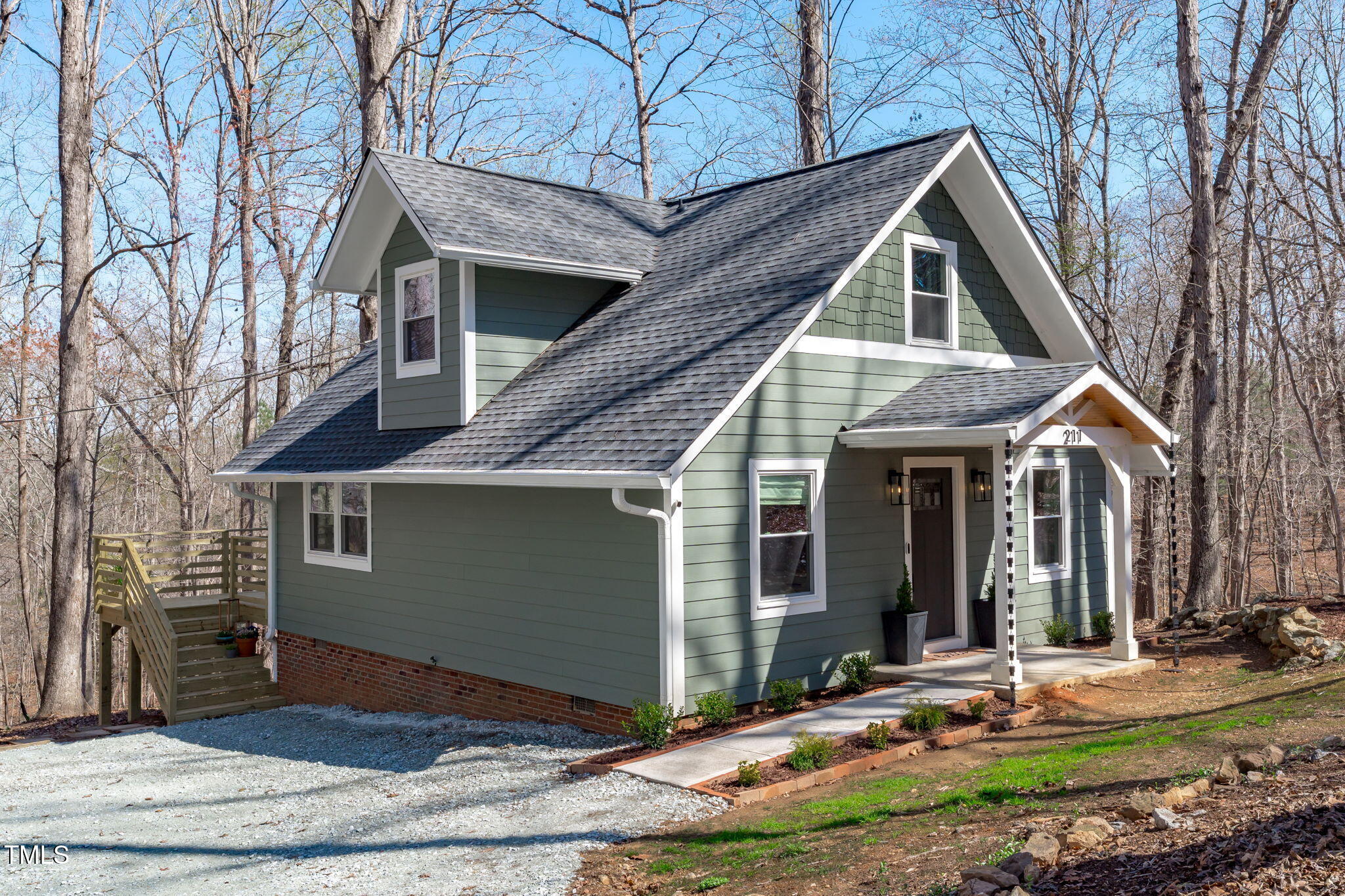 211 Fleming Drive Durham, NC 27712 - Photo 3 of 34 a front view of a house with garden