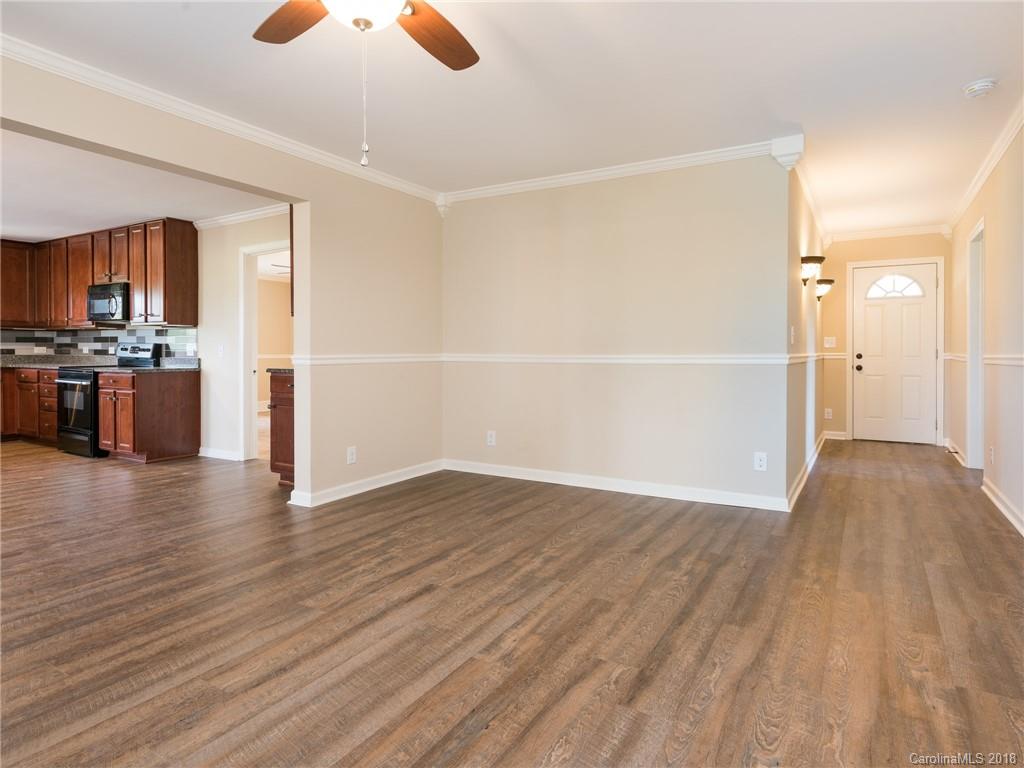2022 Long Hope Road Monroe, NC 28112 - Photo 2 of 28 a view of kitchen and empty room with wooden floor